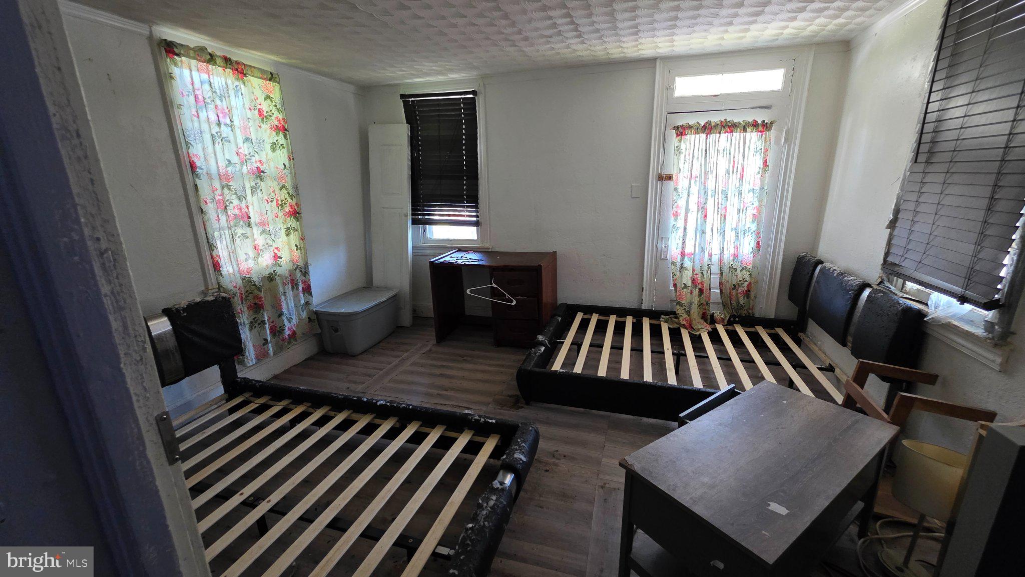 917 Baltimore Street Hanover, PA 17331 - Photo 11 of 19 Bright, airy room with floral curtains.