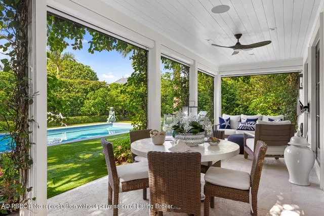 a dining room with furniture window and outside view
