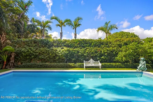 a view of a chairs and table in the garden
