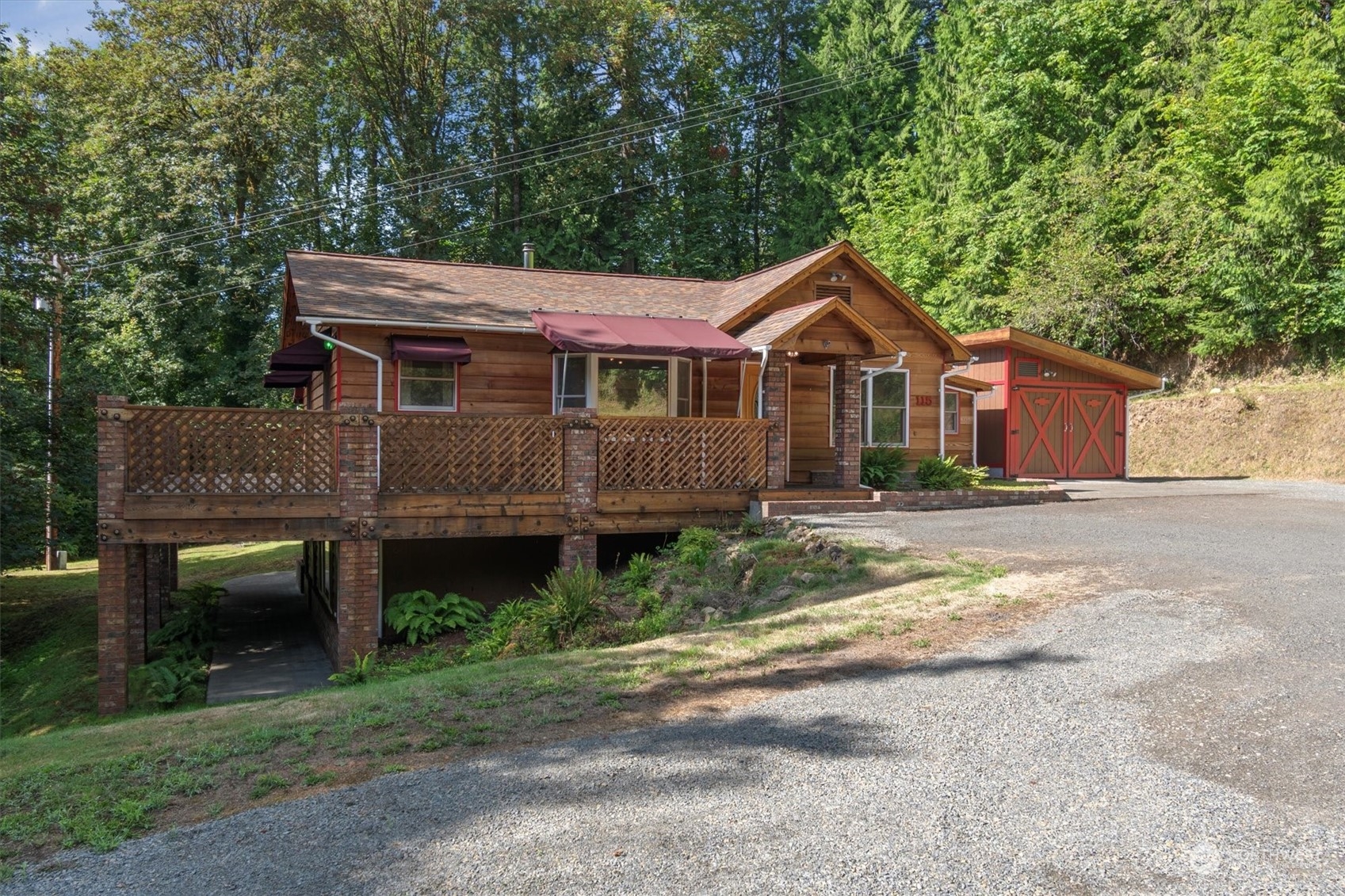 115 Don Martin Road Longview, WA 98632 - Photo 1 of 40 a front view of a house with a garden and plants