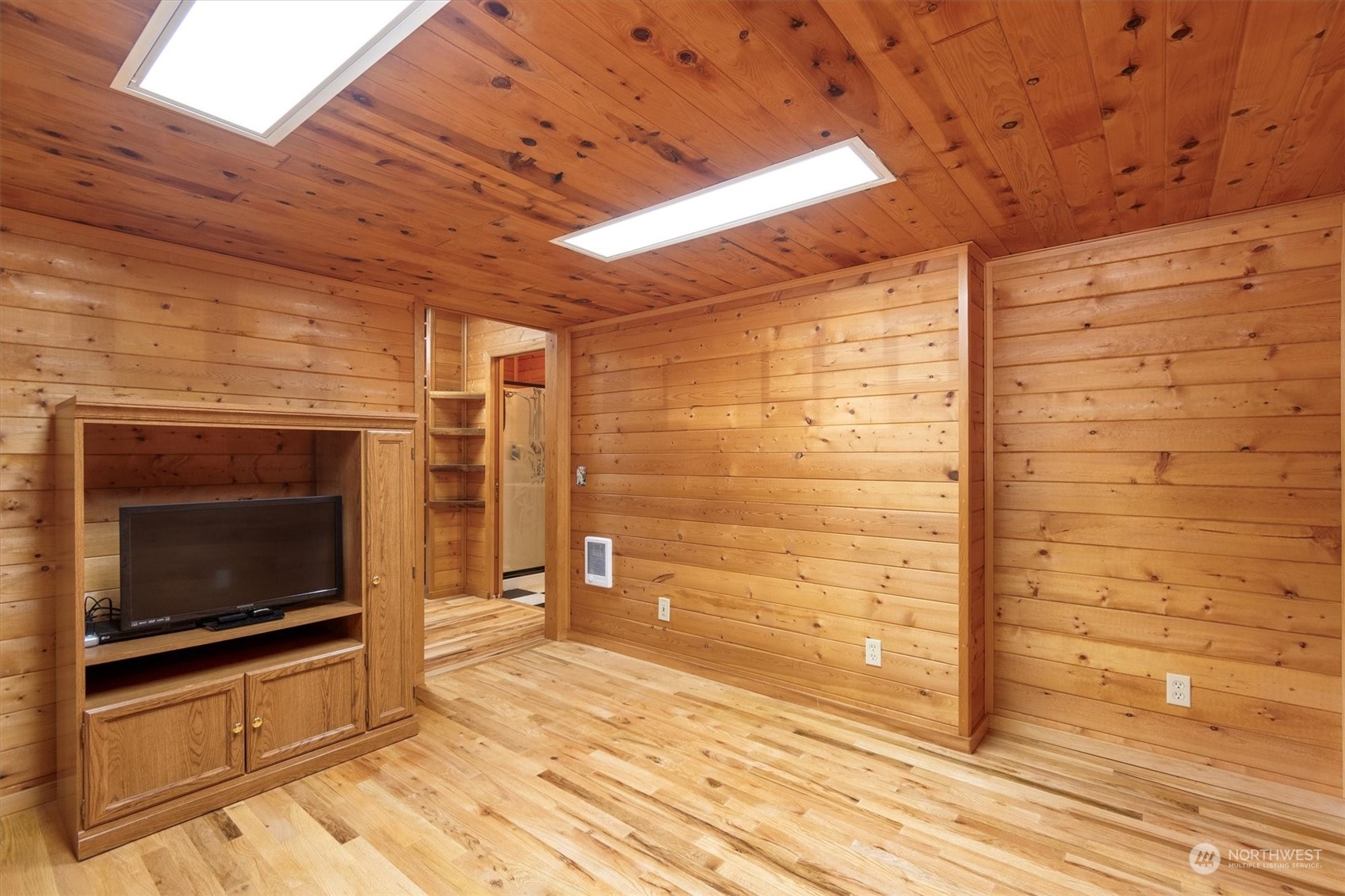 115 Don Martin Road Longview, WA 98632 - Photo 17 of 40 a bathroom with a wooden floor and a washing machine