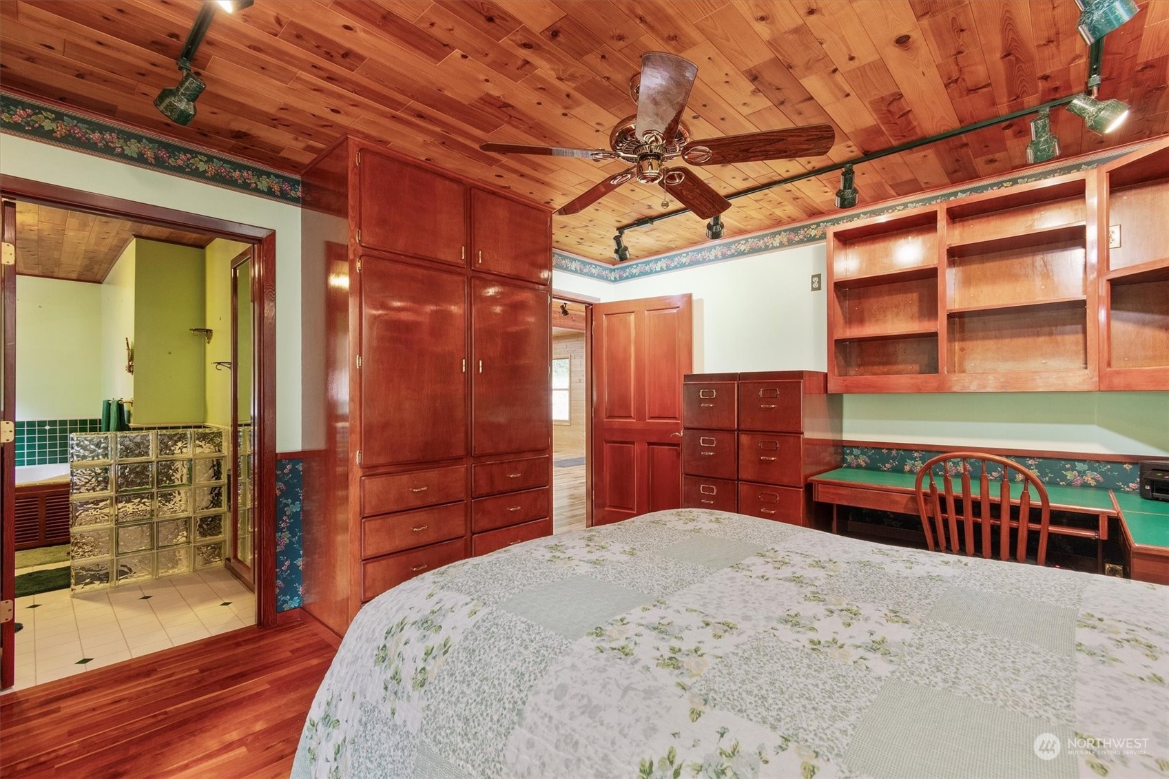 115 Don Martin Road Longview, WA 98632 - Photo 10 of 40 a bedroom with a bed and a cabinets