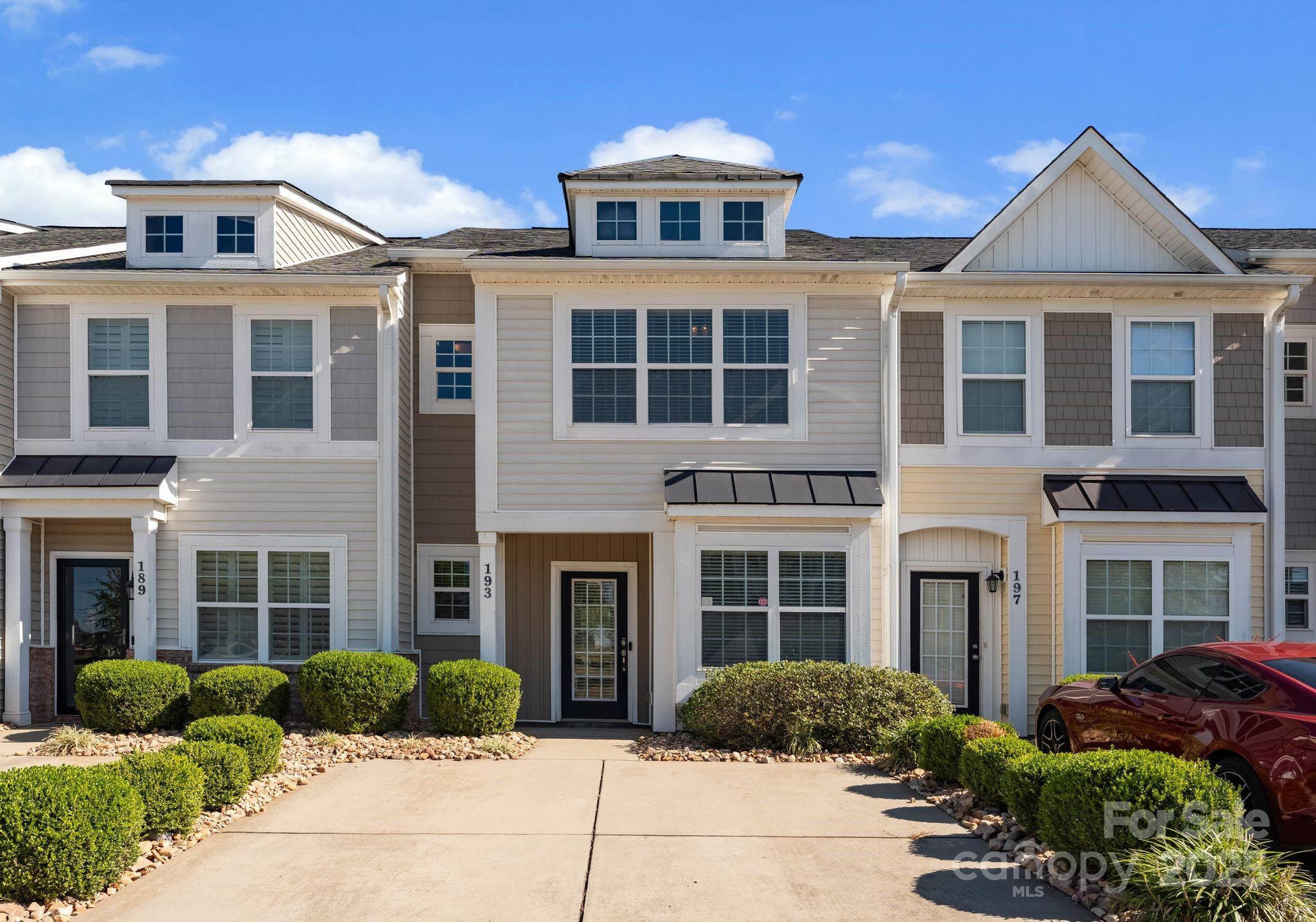 193 Halton Crossing Drive Southwest Concord, NC 28027 - Photo 1 of 20 a front view of a house with a yard