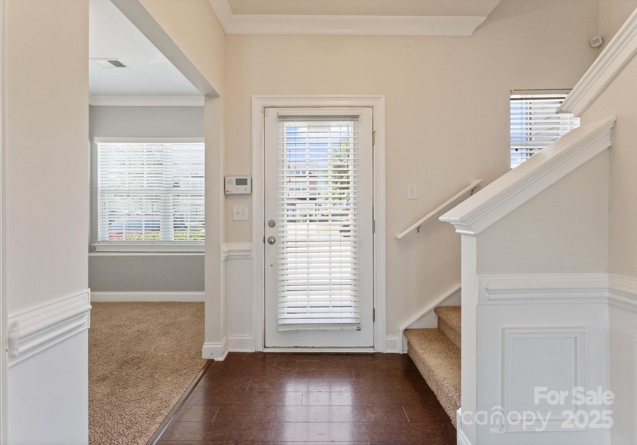 193 Halton Crossing Drive Southwest Concord, NC 28027 - Photo 11 of 20 a view of entryway with wooden floor and stairs