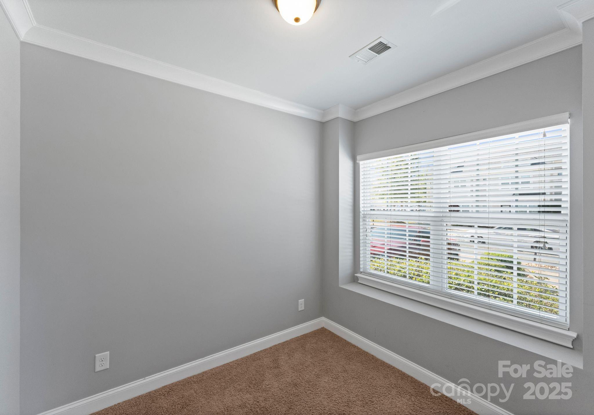 193 Halton Crossing Drive Southwest Concord, NC 28027 - Photo 12 of 20 a view of an empty room with a window