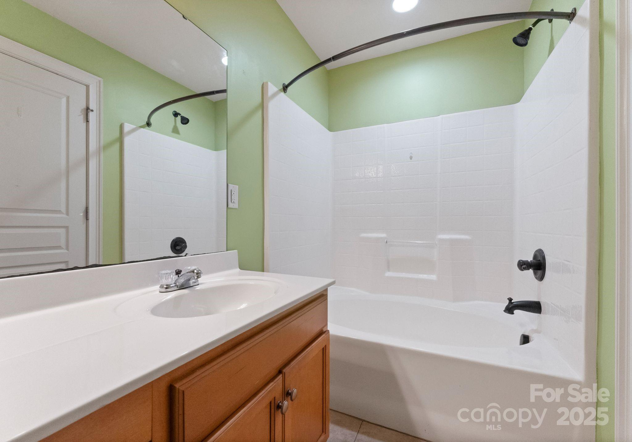193 Halton Crossing Drive Southwest Concord, NC 28027 - Photo 16 of 20 a bathroom with a sink and a mirror
