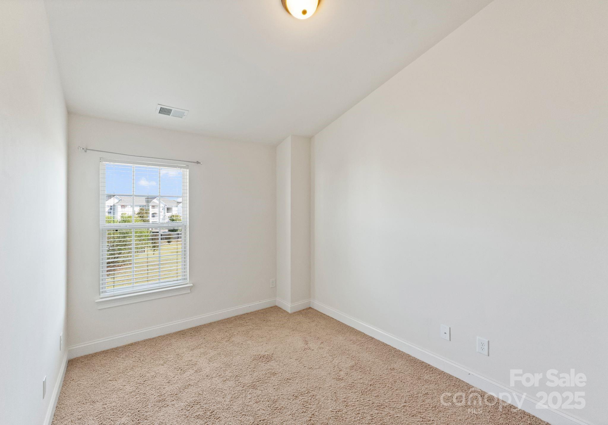 193 Halton Crossing Drive Southwest Concord, NC 28027 - Photo 17 of 20 an empty room with windows