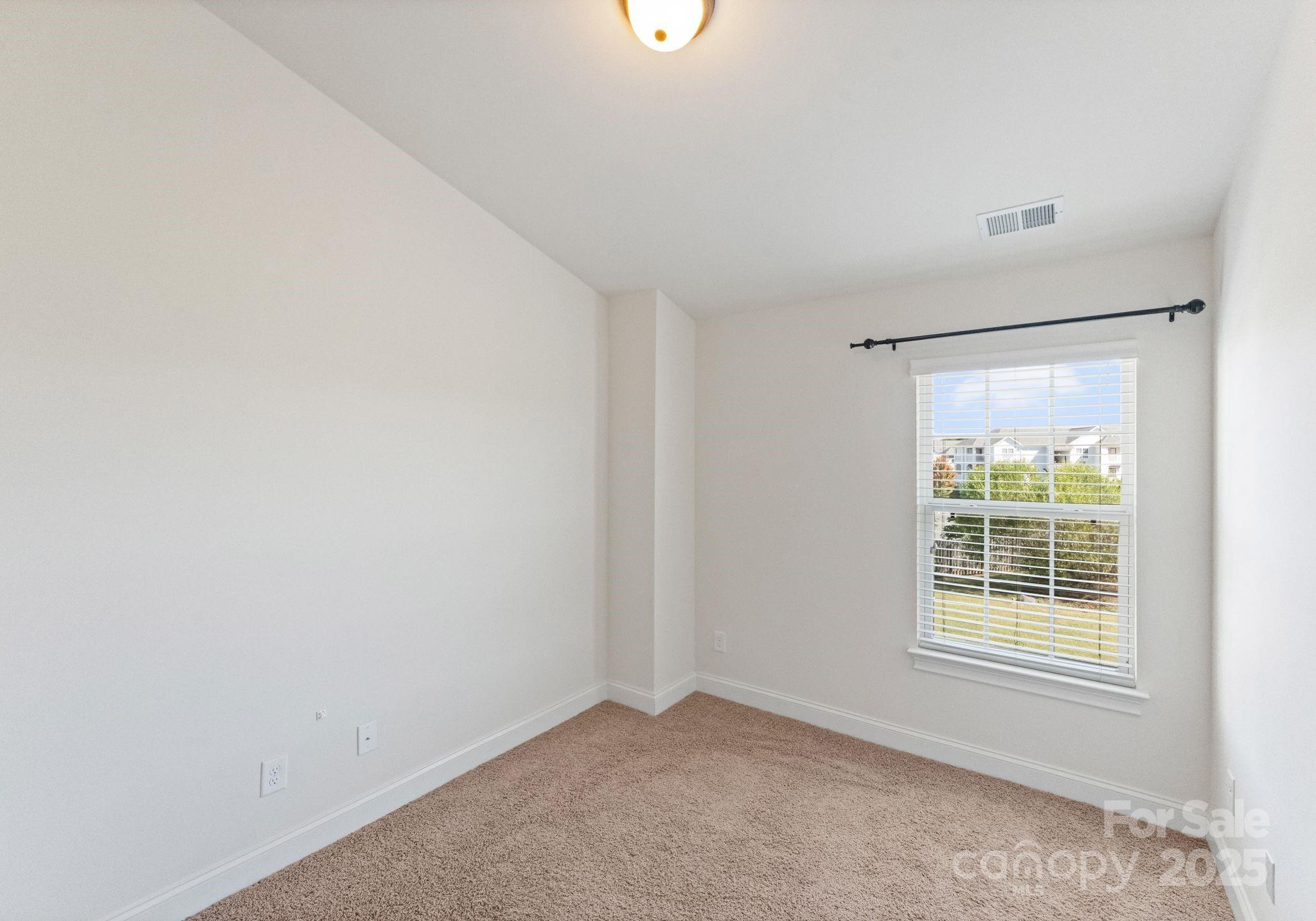 193 Halton Crossing Drive Southwest Concord, NC 28027 - Photo 19 of 20 a view of an empty room with a window