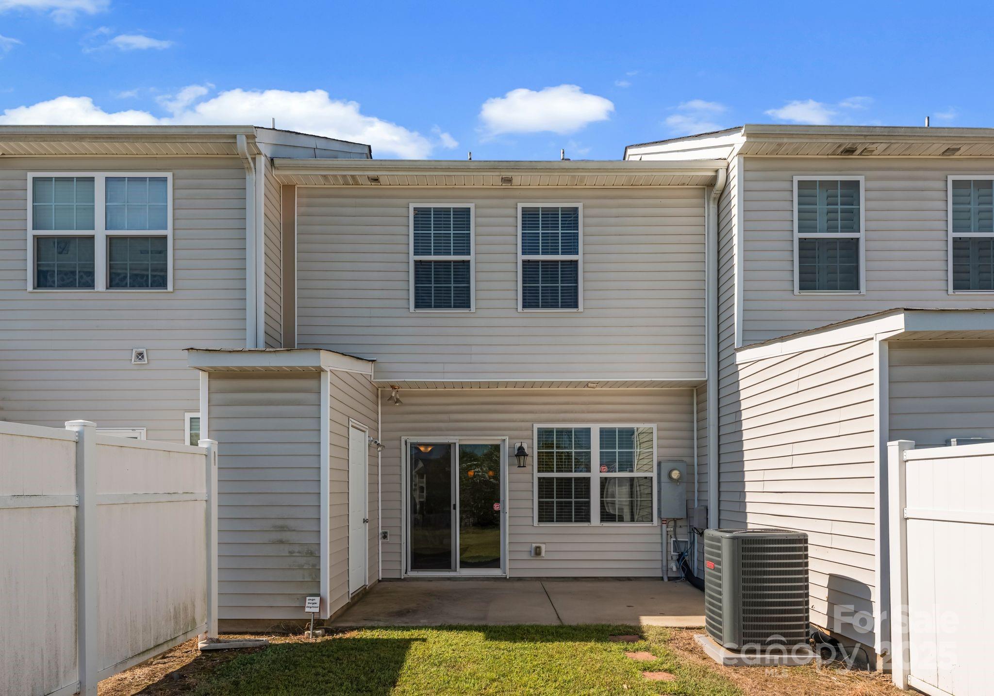 193 Halton Crossing Drive Southwest Concord, NC 28027 - Photo 20 of 20 a view of a house with a large window and more windows