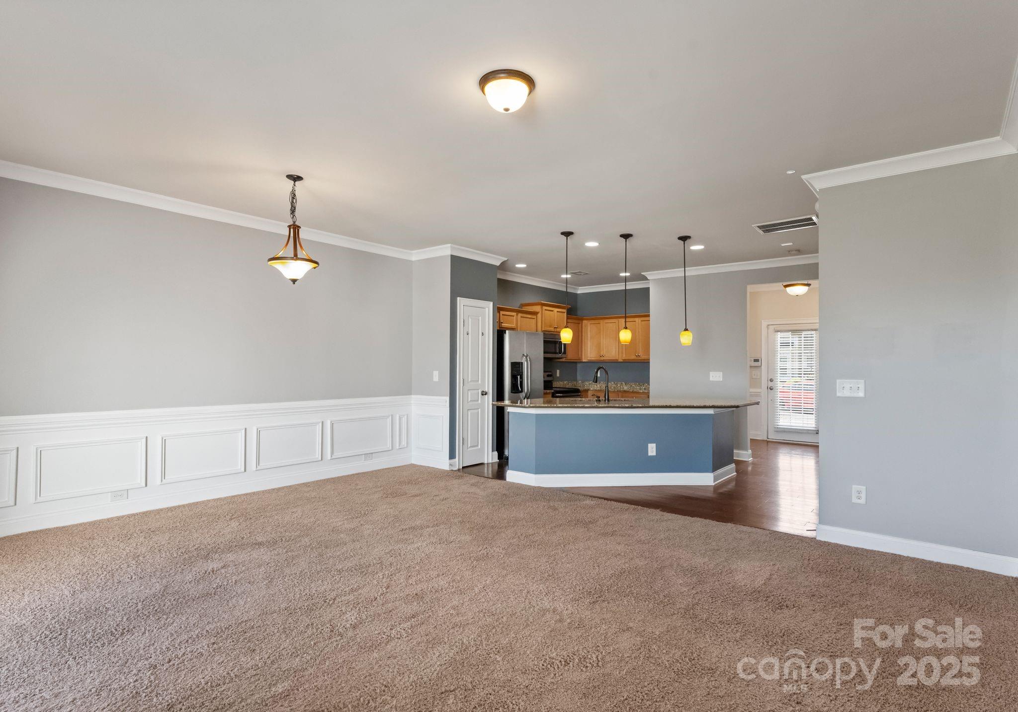 193 Halton Crossing Drive Southwest Concord, NC 28027 - Photo 3 of 20 a view of an empty room with a kitchen