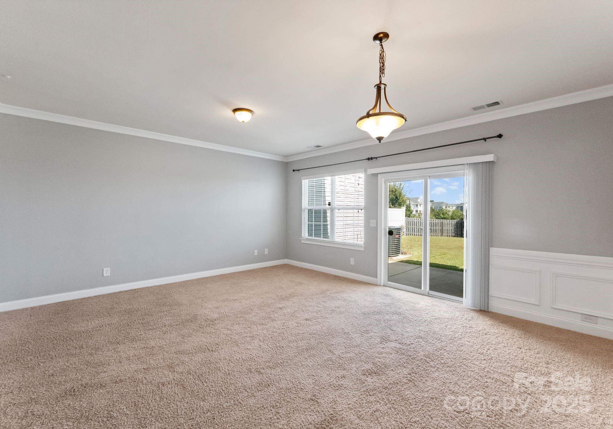 193 Halton Crossing Drive Southwest Concord, NC 28027 - Photo 5 of 20 a view of an empty room with a window