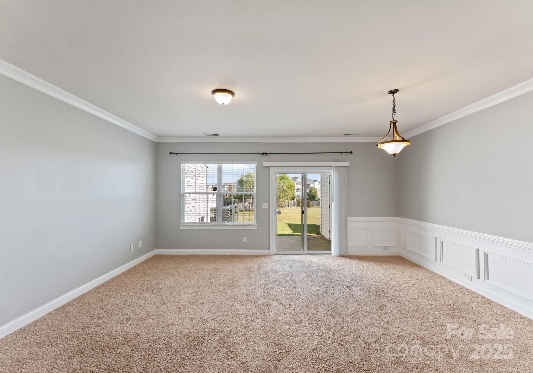 193 Halton Crossing Drive Southwest Concord, NC 28027 - Photo 6 of 20 wooden floor in an empty room with a window