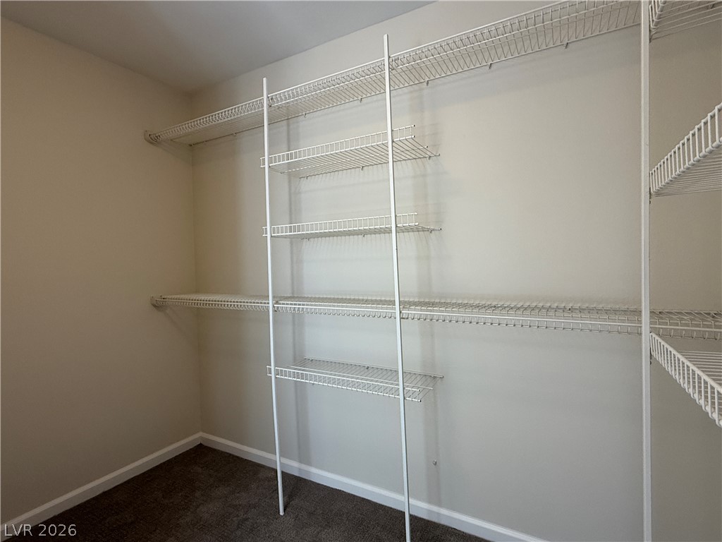 1908 Thunder Ridge Circle Henderson, NV 89012 - Photo 14 of 28 Ample wire shelving units outfit this functional walk-in closet, ready for personalized organization.