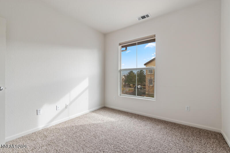 1325 South Meadows Parkway, Unit 621 Reno, NV 89521 - Photo 11 of 18 a view of an empty room with a window