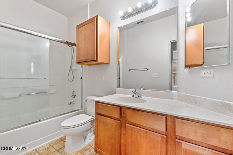 1325 South Meadows Parkway, Unit 621 Reno, NV 89521 - Photo 13 of 18 a bathroom with a sink a toilet and shower