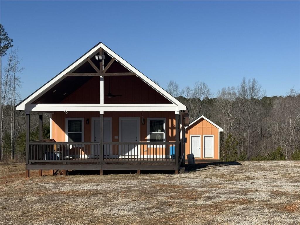 3445 Silas Mercer Road Northeast Crawfordville, GA 30631 - Photo 4 of 12 a front view of a house with a yard