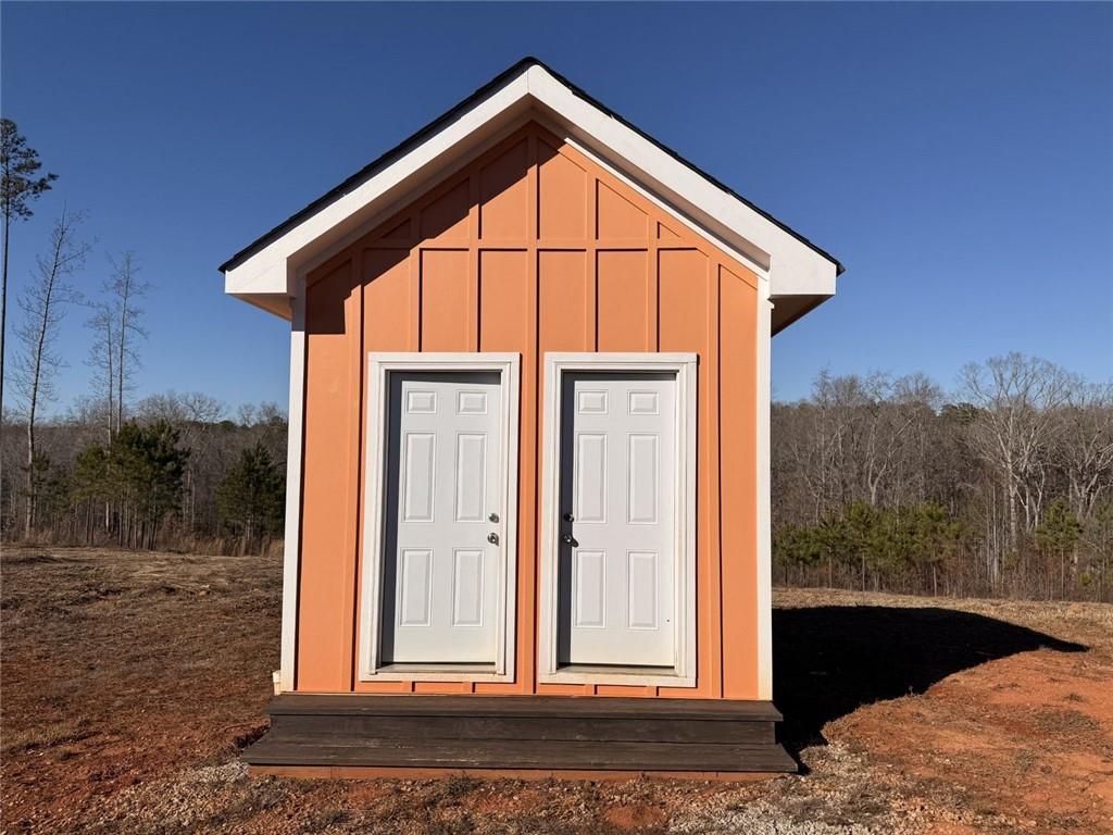 3445 Silas Mercer Road Northeast Crawfordville, GA 30631 - Photo 5 of 12 a view of a house with a yard