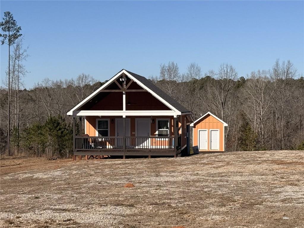 3445 Silas Mercer Road Northeast Crawfordville, GA 30631 - Photo 6 of 12 a front view of a house with a yard