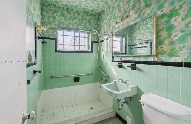 a bathroom with a sink and mirror