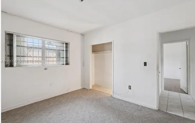 a kitchen with stainless steel appliances granite countertop a refrigerator and a stove