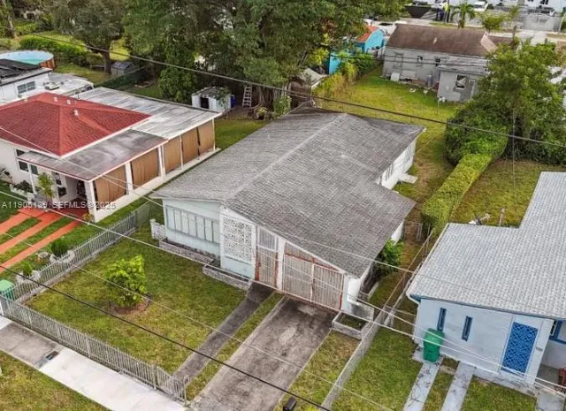 an aerial view of houses with outdoor space