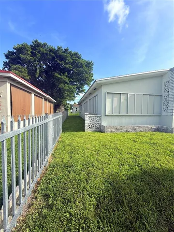 a view of backyard with green space