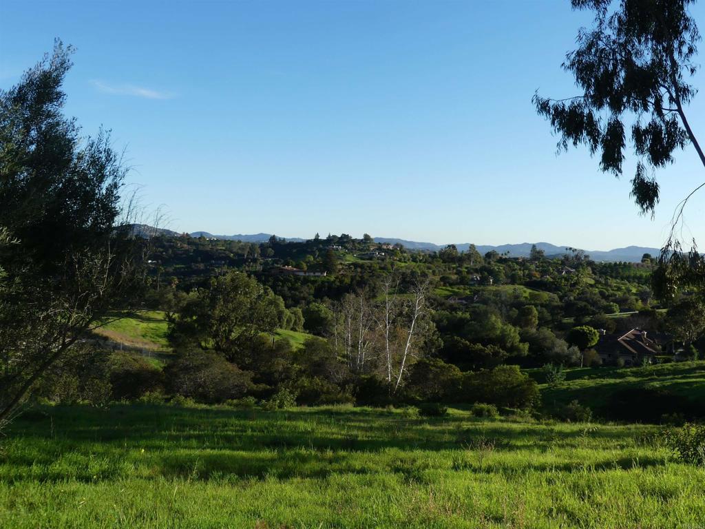 725 Yucca Road Fallbrook, CA 92028 - Photo 6 of 46 a view of a lake in front of house with green space