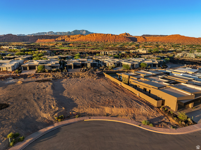 0 St. George, UT 84770 - Photo 6 of 25 Expansive undeveloped lot with street frontage, surrounded by modern residences and natural rock formations
