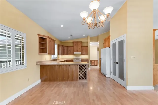 a view of a kitchen and a window