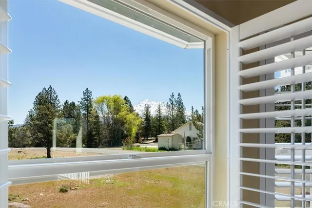 a view of a swimming pool with an outdoor seating