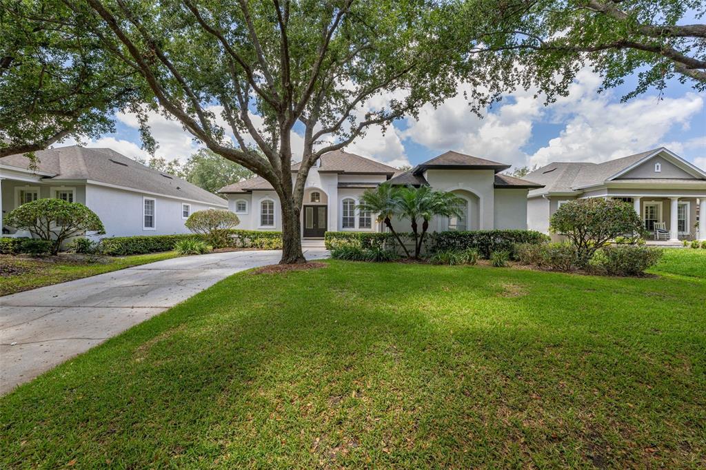 8351 Bowden Way Windermere, FL 34786 - Photo 2 of 71 a front view of house with yard and green space