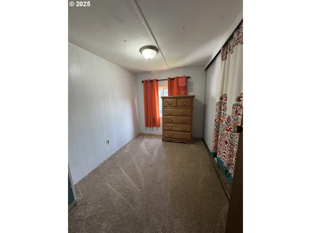 a view of room with stairs and a window