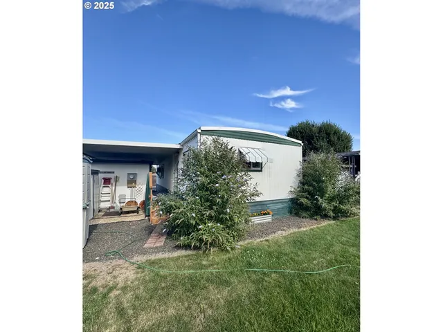 a backyard of a house with a yard and garage