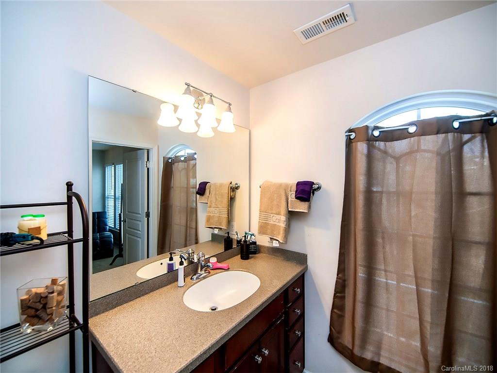 566 6th Baxter Crossing Fort Mill, SC 29708 - Photo 17 of 25 a bathroom with a sink double vanity and a mirror