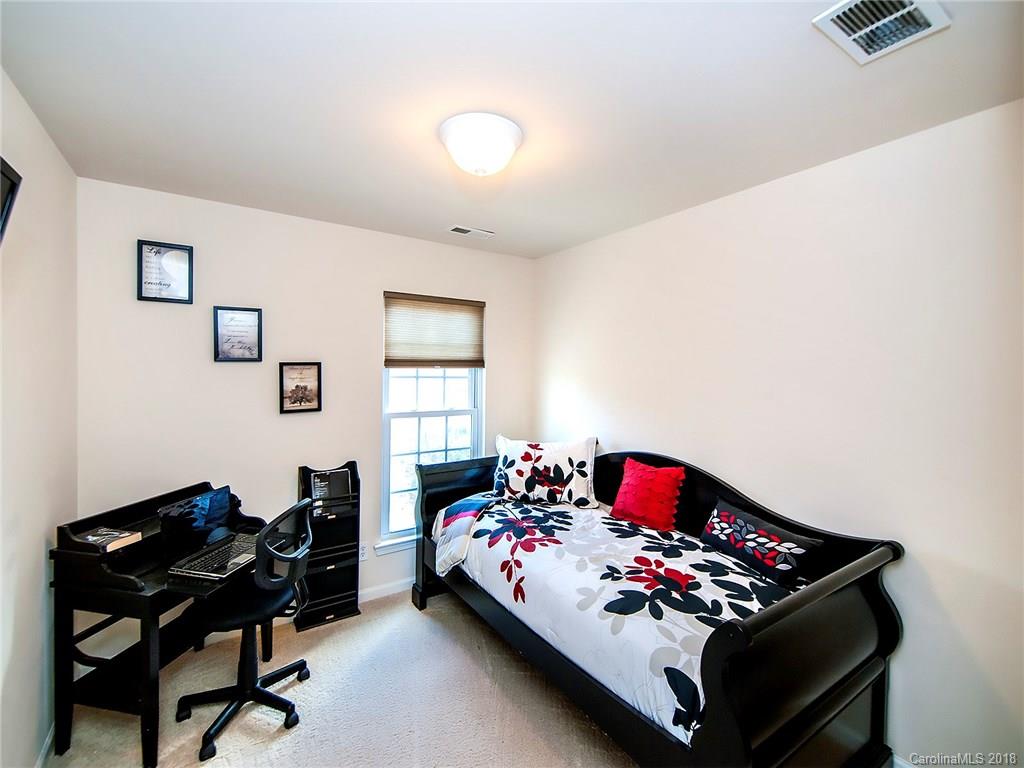 566 6th Baxter Crossing Fort Mill, SC 29708 - Photo 18 of 25 a bed room with a bed chair and a window