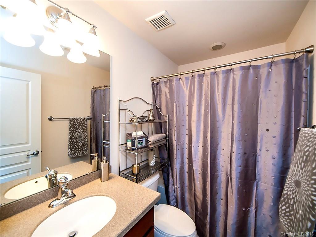 566 6th Baxter Crossing Fort Mill, SC 29708 - Photo 19 of 25 a bathroom with a sink vanity mirror and toilet