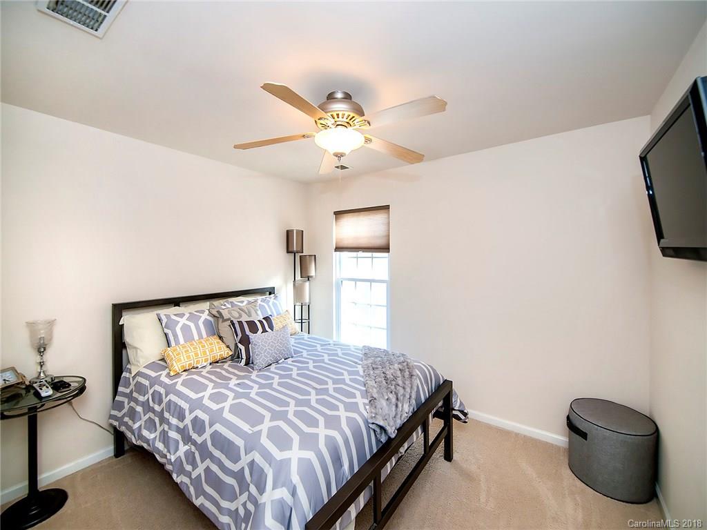 566 6th Baxter Crossing Fort Mill, SC 29708 - Photo 20 of 25 a bedroom with a bed and a tv