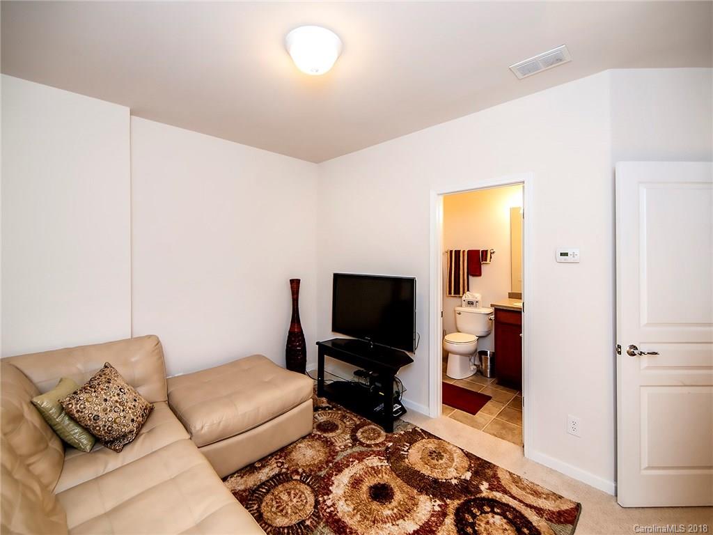 566 6th Baxter Crossing Fort Mill, SC 29708 - Photo 22 of 25 a living room with furniture and a flat screen tv