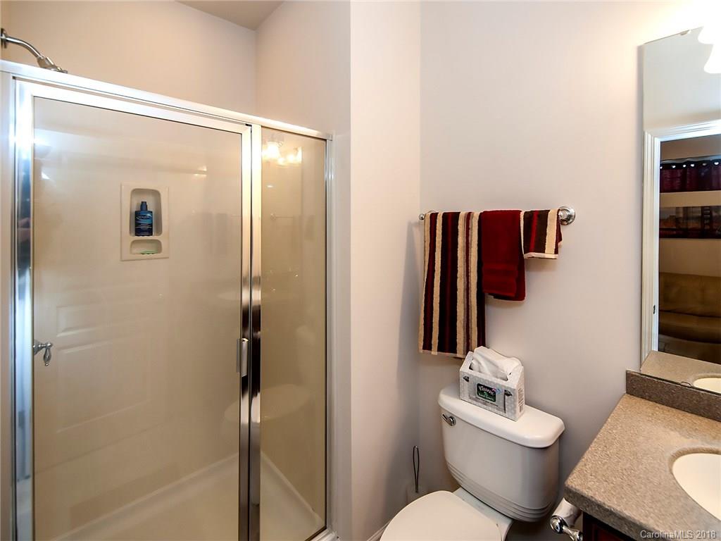 566 6th Baxter Crossing Fort Mill, SC 29708 - Photo 23 of 25 a bathroom with a toilet a sink and shower