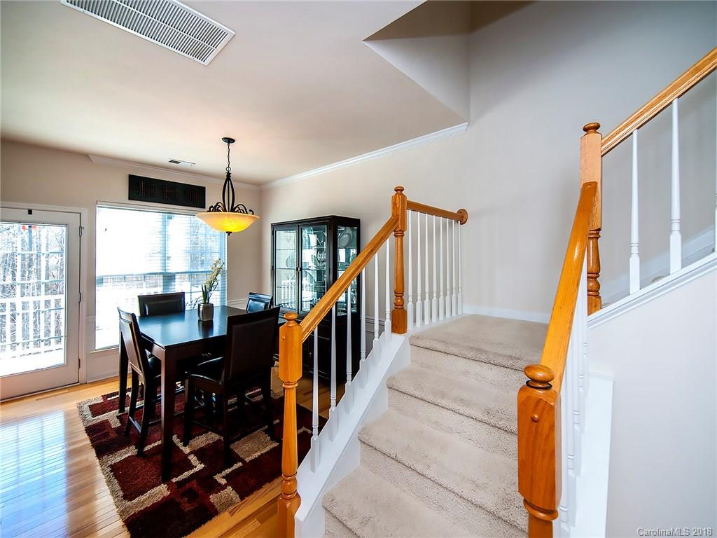 566 6th Baxter Crossing Fort Mill, SC 29708 - Photo 6 of 25 a dining room with wooden floor and furniture