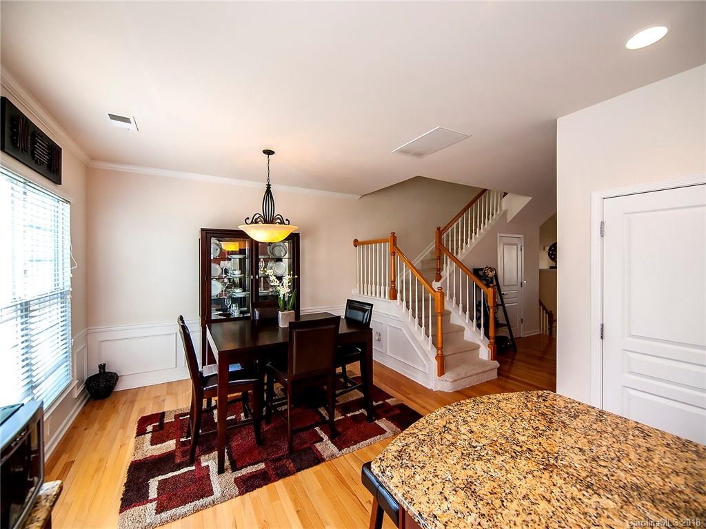 566 6th Baxter Crossing Fort Mill, SC 29708 - Photo 10 of 25 a view of a dining room with furniture window and wooden floor