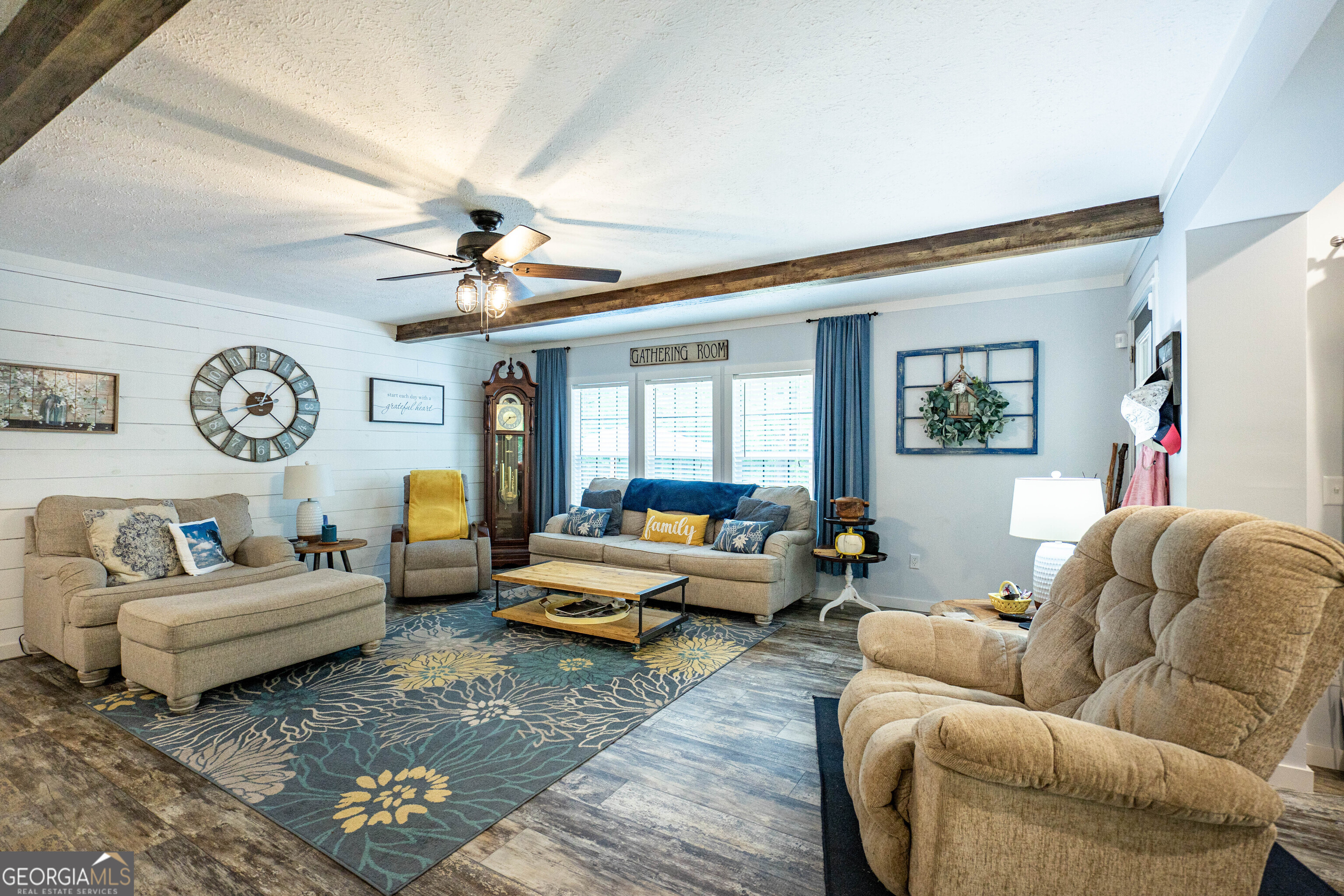 1249 County Road 446 Five Points, AL 36855 - Photo 12 of 41 a living room with furniture ceiling fan and a rug