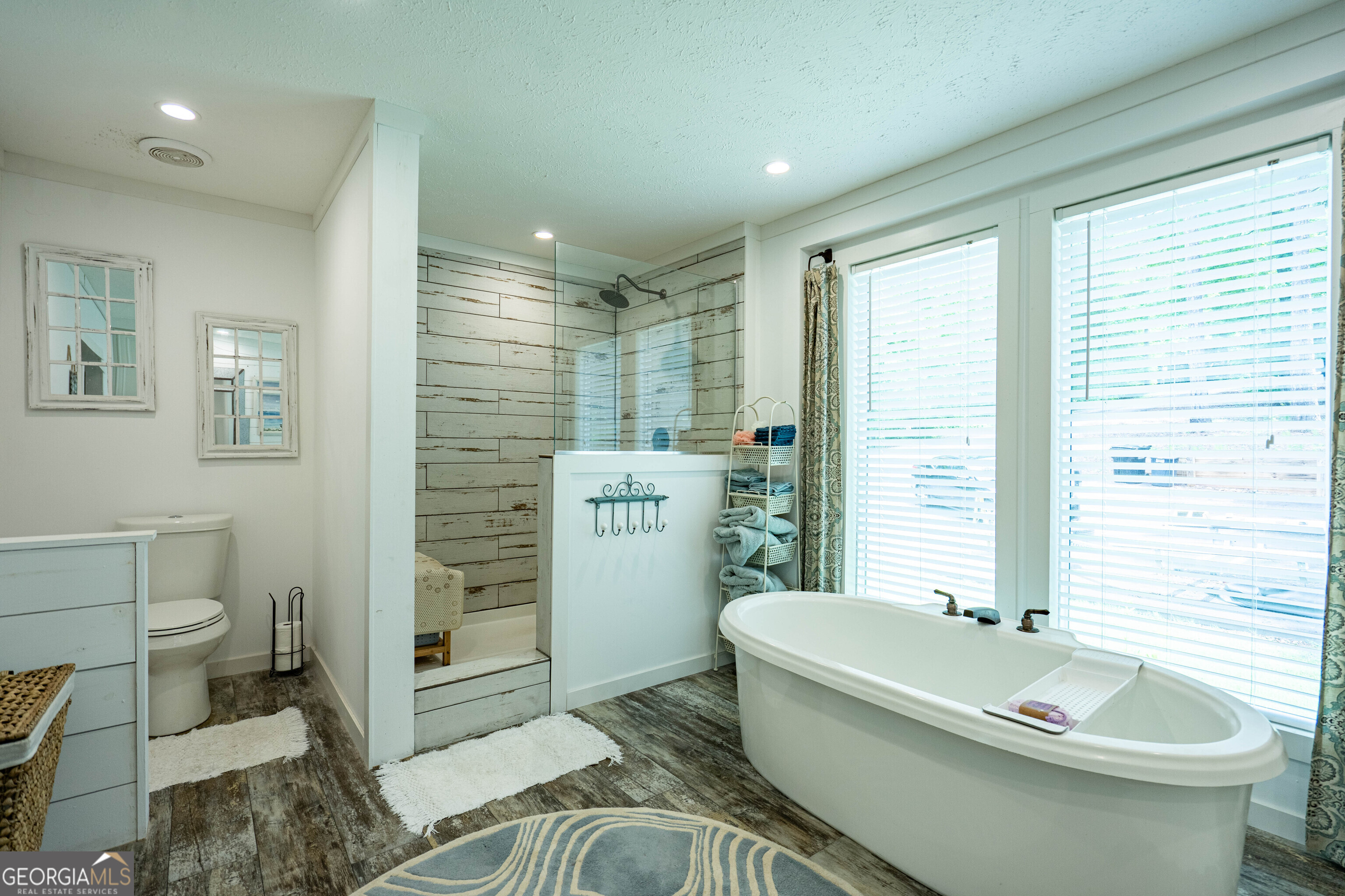 1249 County Road 446 Five Points, AL 36855 - Photo 22 of 41 a bathroom with a sink a toilet a tub and shower