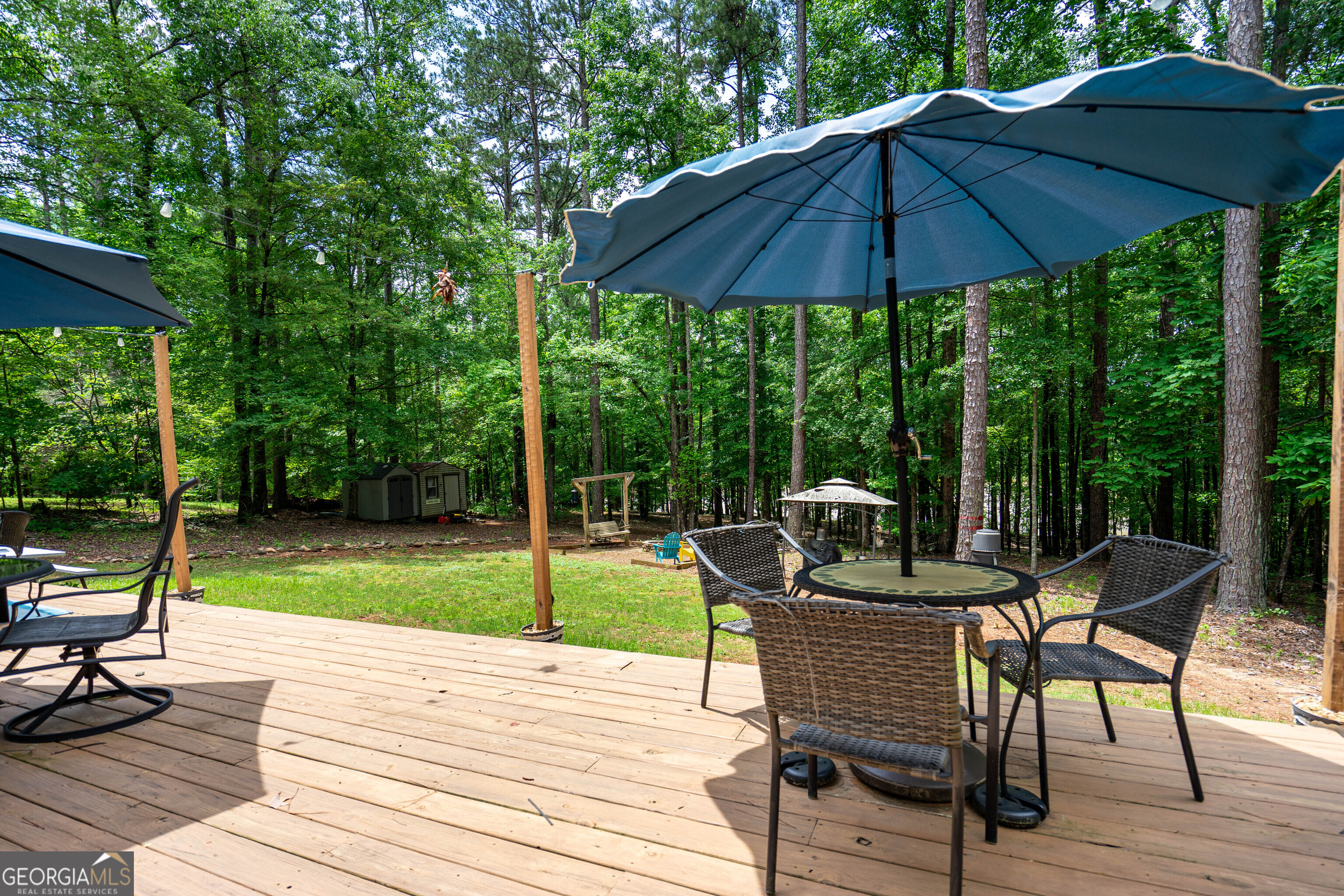 1249 County Road 446 Five Points, AL 36855 - Photo 26 of 41 a view of a table and chairs on the deck