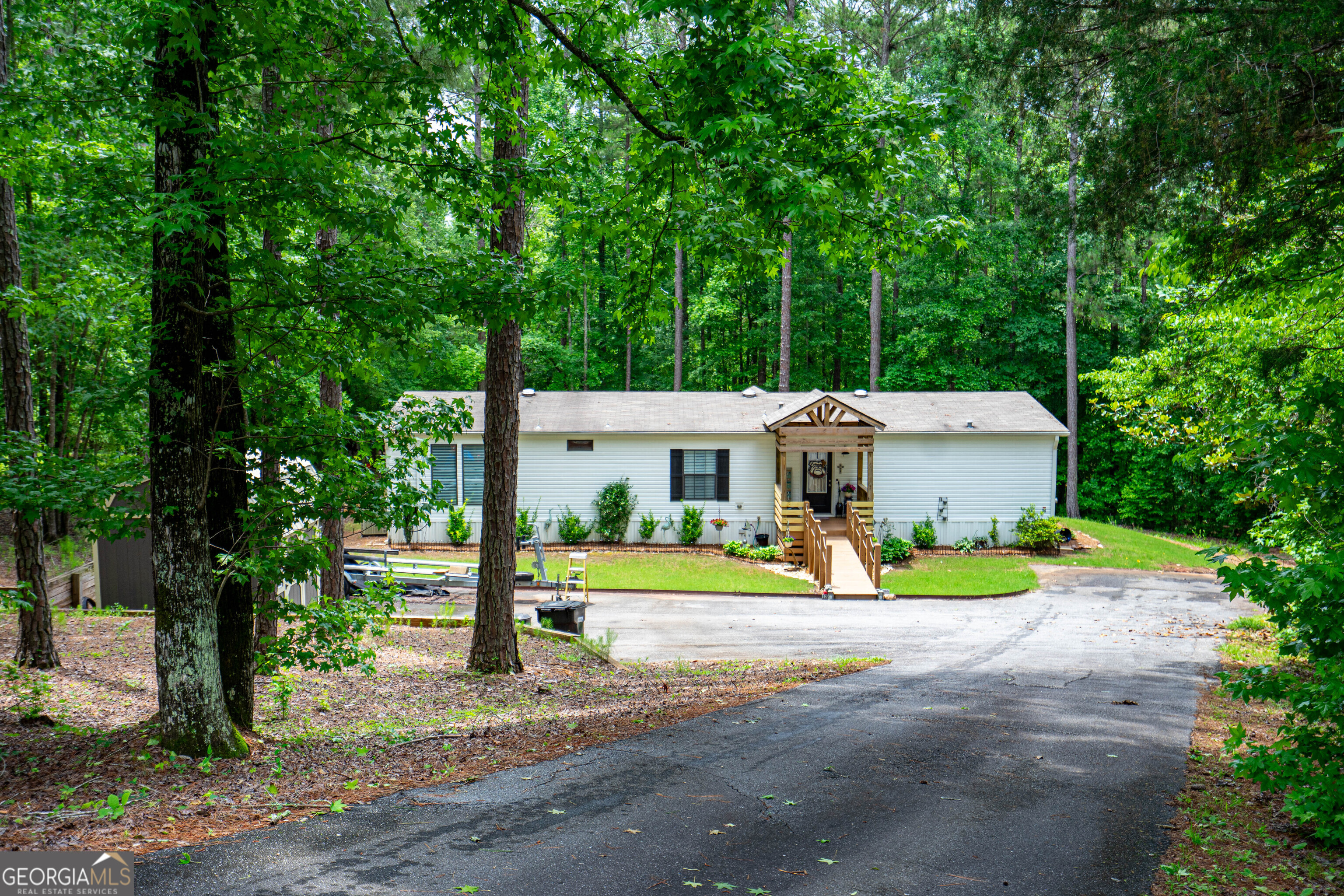1249 County Road 446 Five Points, AL 36855 - Photo 3 of 41 a front view of a house with a yard and sitting area