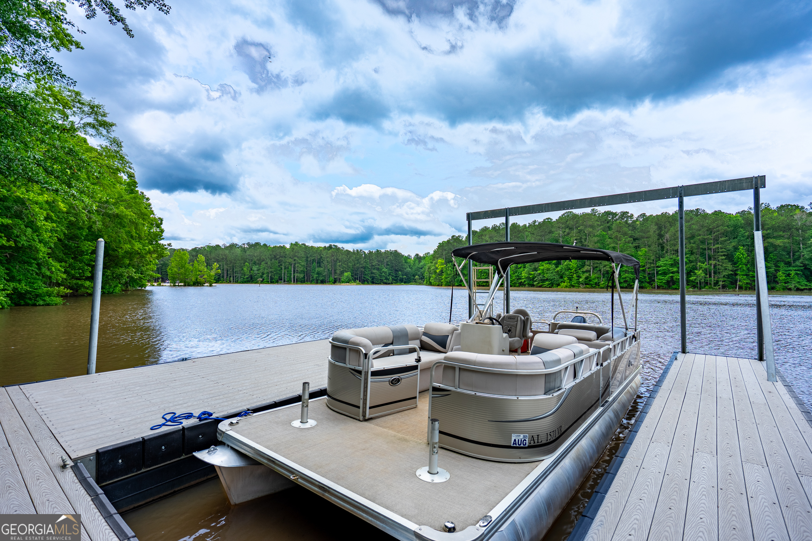 1249 County Road 446 Five Points, AL 36855 - Photo 34 of 41 a view of a roof deck with couches wooden floor and lake view