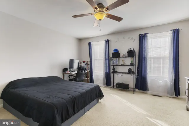 a bed room with a bed and a chandelier