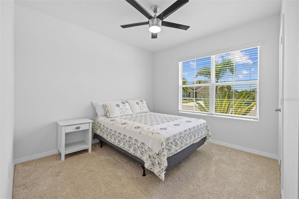 2721 Greenleaf Terrace Parrish, FL 34219 - Photo 11 of 65 a bed sitting in a bedroom next to a window