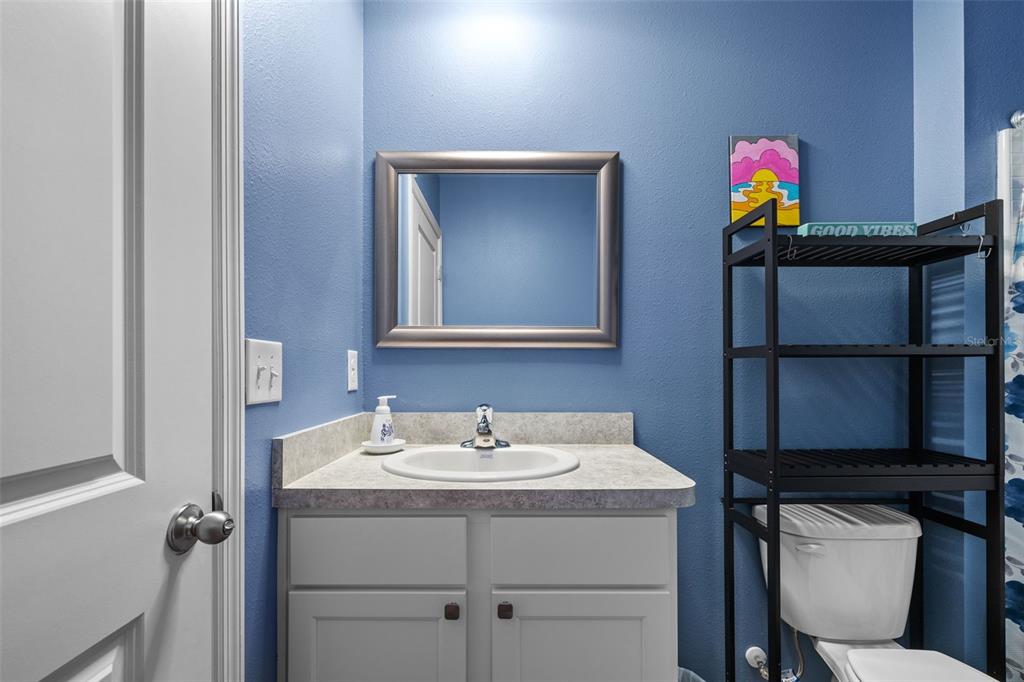 2721 Greenleaf Terrace Parrish, FL 34219 - Photo 14 of 65 a bathroom with a sink a vanity and a mirror