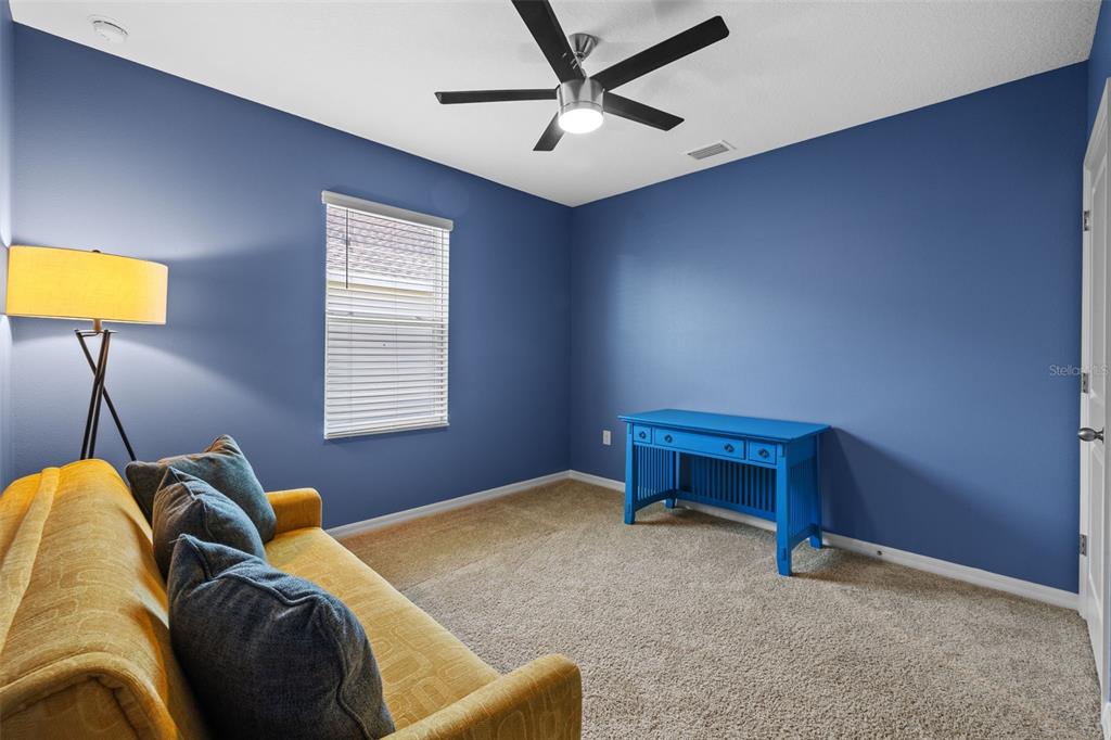 2721 Greenleaf Terrace Parrish, FL 34219 - Photo 19 of 65 a bedroom with a bed and a window